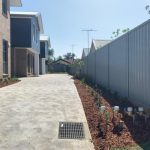 Raked colorbond fence