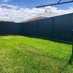 Colorbond fence with sleepers