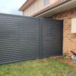 Monument colour aluminium slat gate and fixed panel
